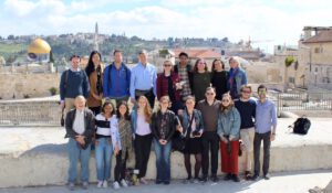 Students taking picture with Dome of the Rock in the background