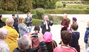 a man explaining to a group about the city