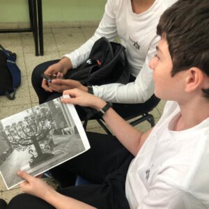 A boy holdinga picture of a Menora