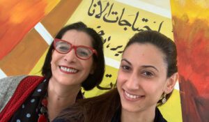 two teachers smiling and taking picture