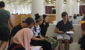 Students studying and talking to each other