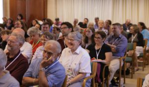 Woman laughing among the audience