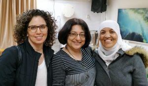 Three women posing for a picture together