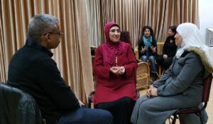 Three people talking to each other