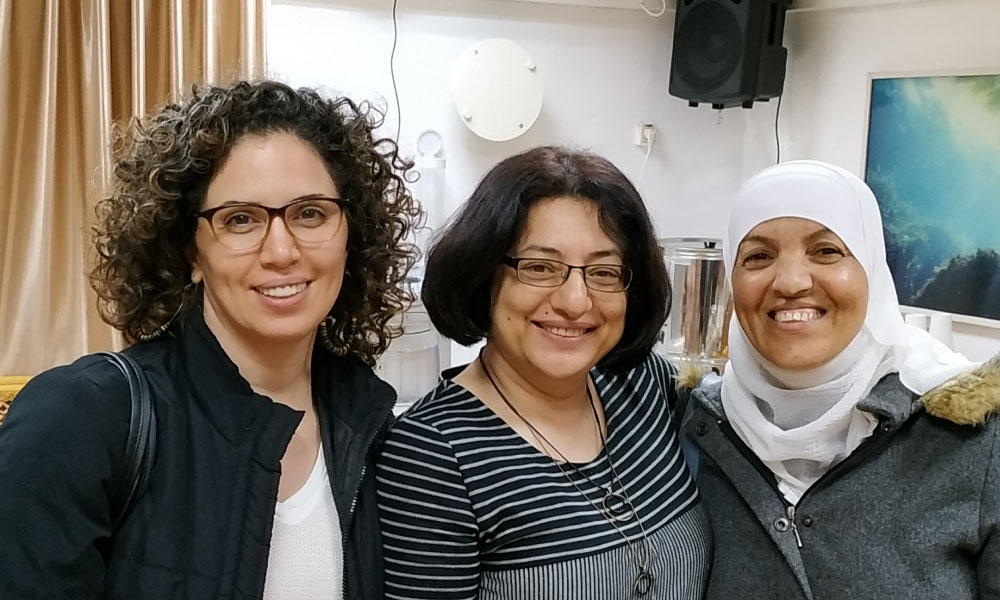 Three women smiling