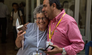 Two people hugging nad smiling