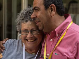 Two participants hugginh each other