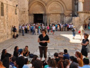 Hana the tour guide teaching a group just outside the church of resurrection