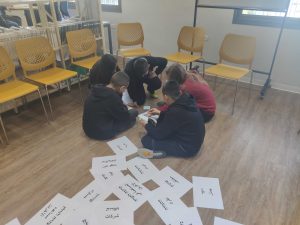 Children sitting next to each other